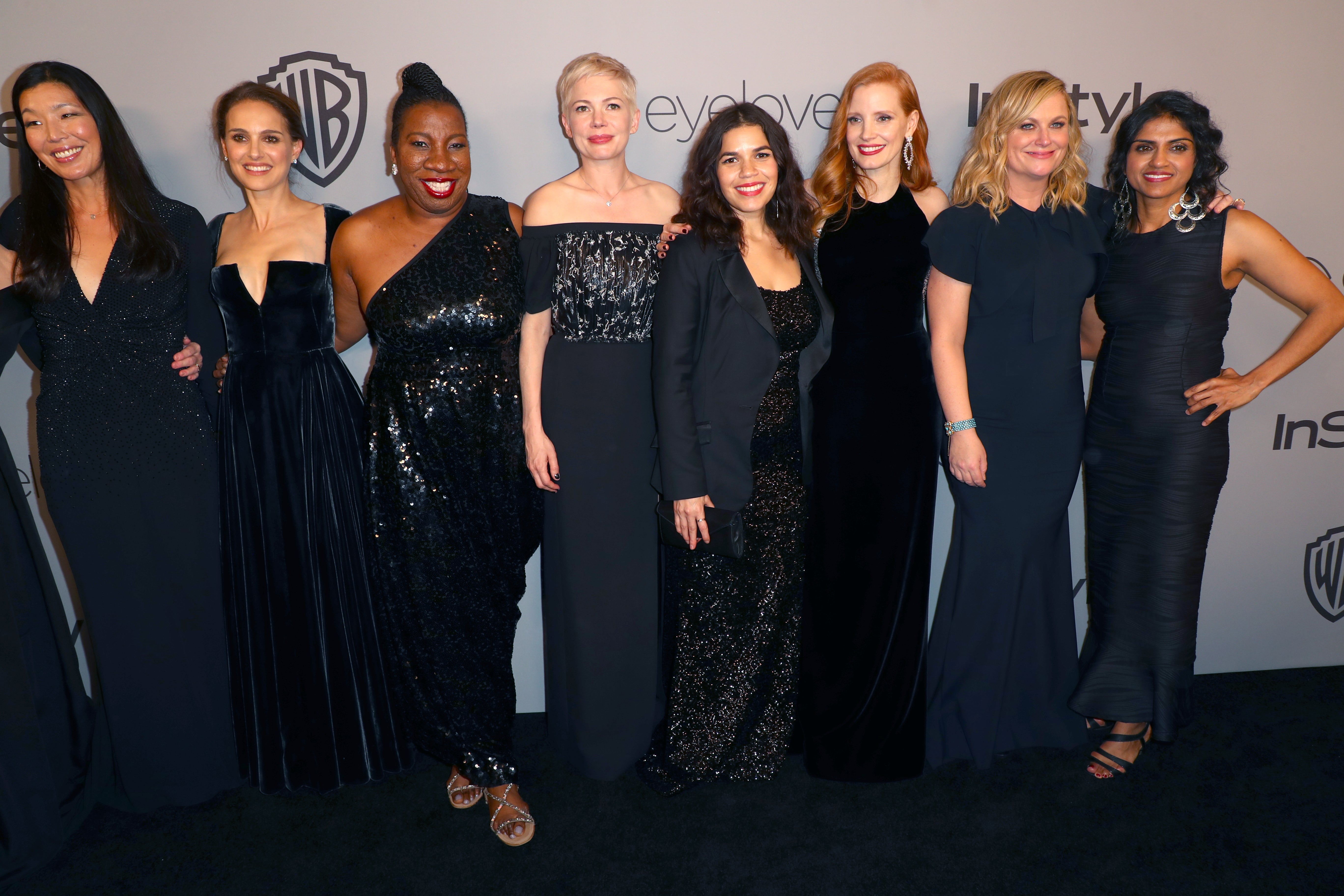 Ai-jen Poo, Natalie Portman, Tarana Burke, Michelle Williams, America Ferrera, Jessica Chastain, Amy Poehler and Saru Jayaraman pose together at the 75th Annual Golden Globe Awards Post-Party