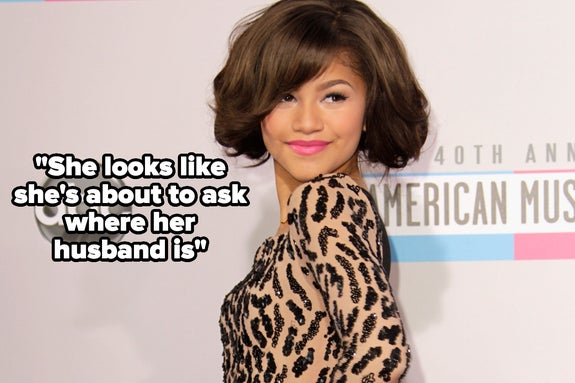 Person in leopard print dress with humorous caption about marital status at an event backdrop