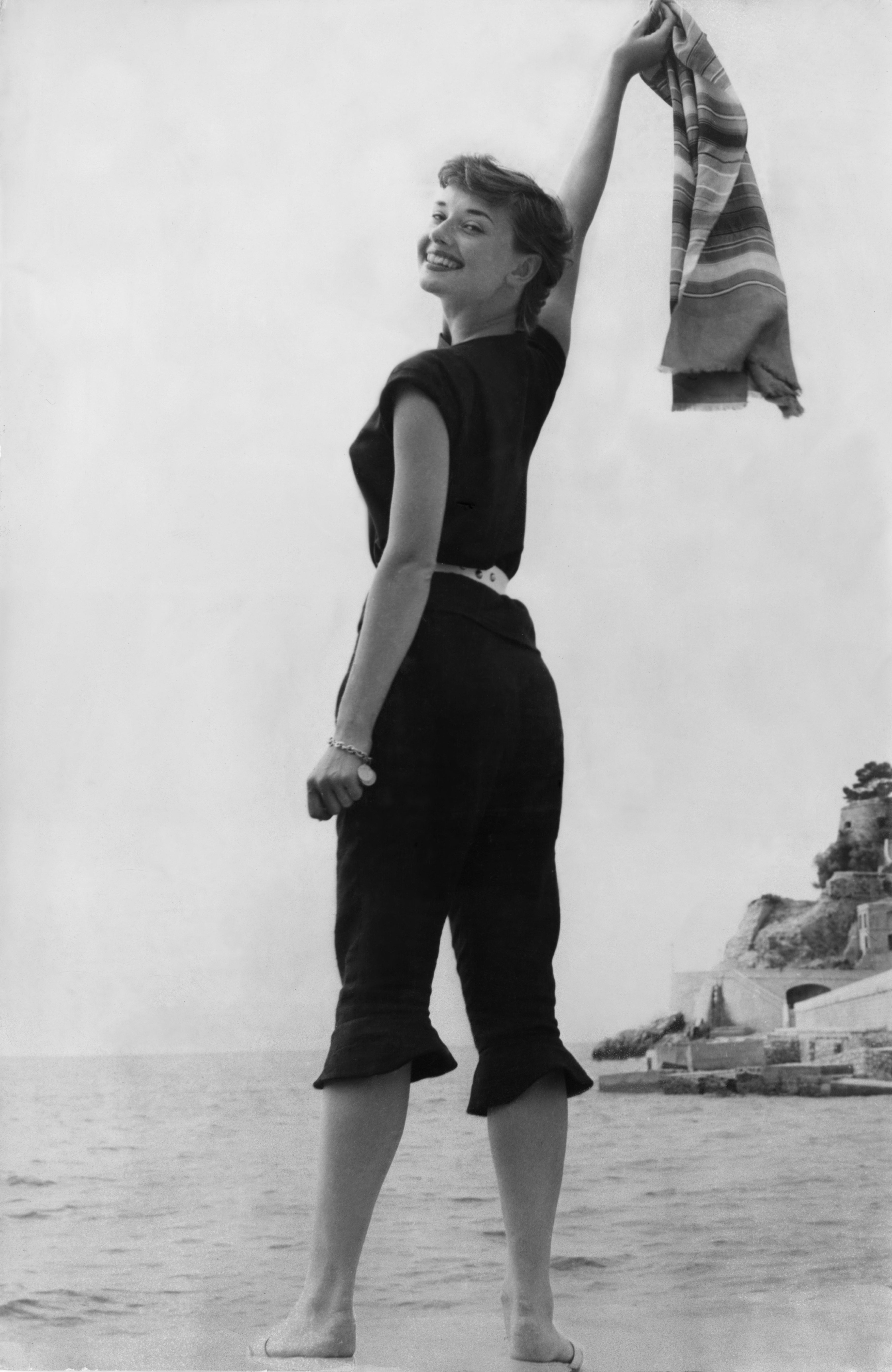 Vintage photo of Audrey Hepburn smiling at the beach