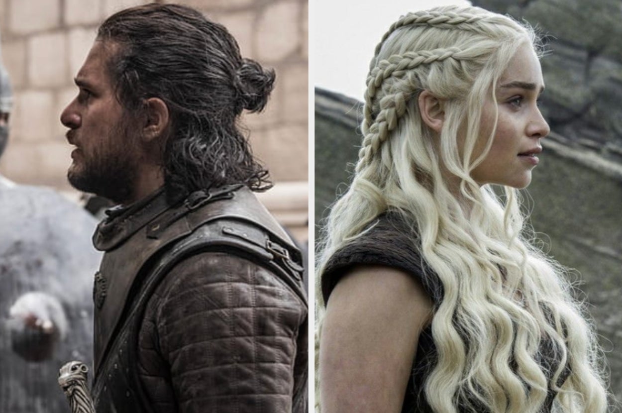 Two people in medieval-style clothing and intricate braided hairstyles are standing in profile