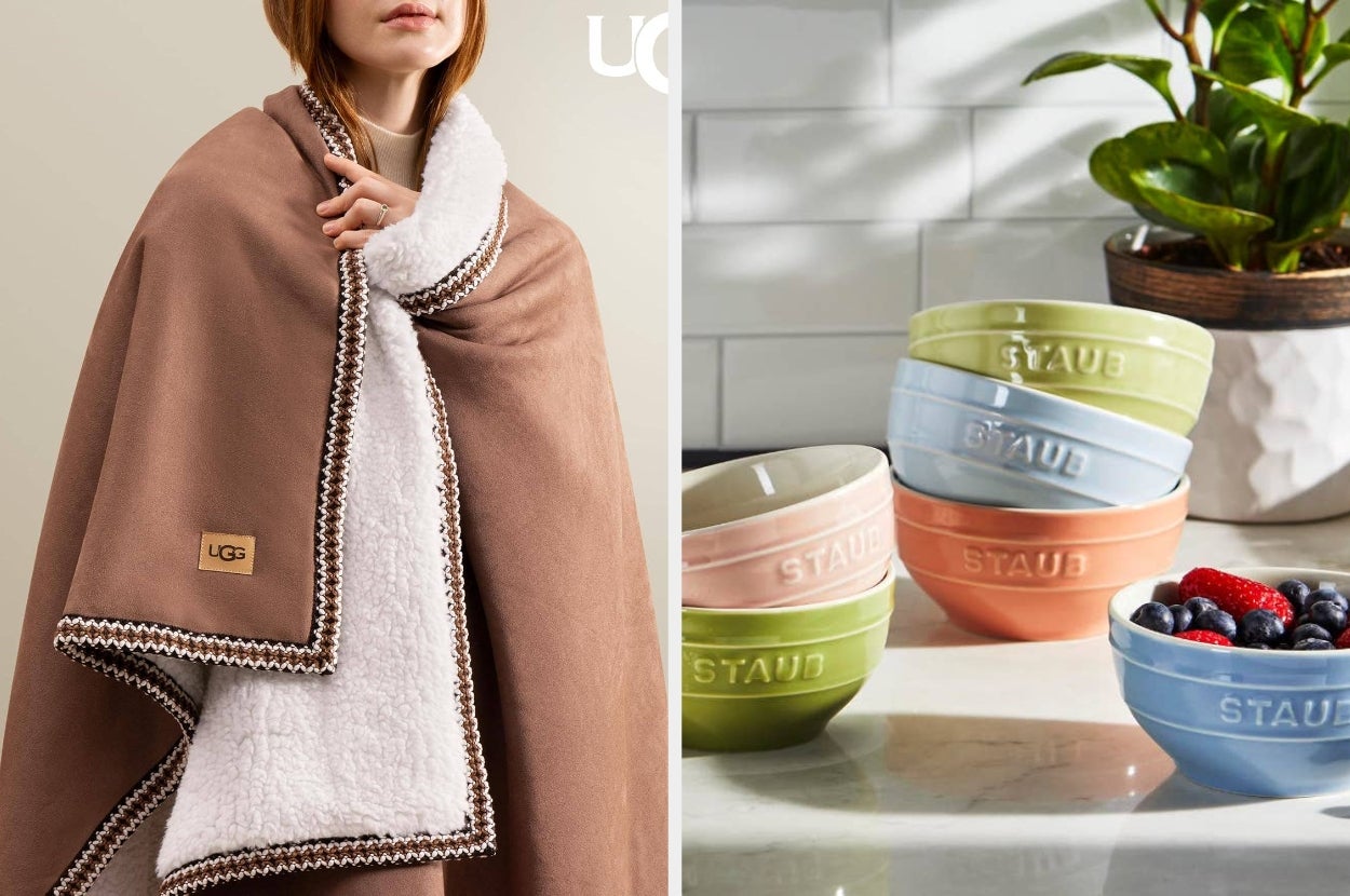 Person wrapped in a cozy blanket and stacked pastel ceramic bowls next to a bowl of berries on a kitchen counter