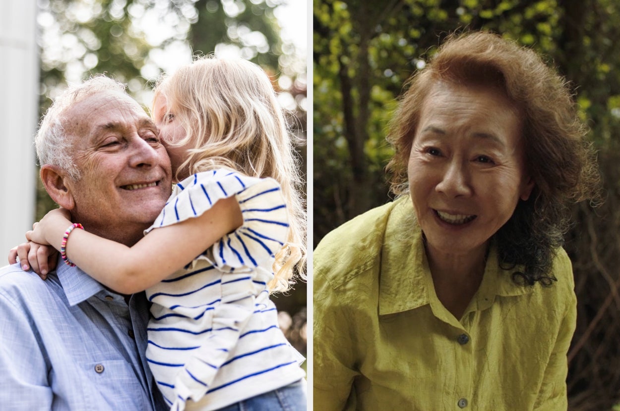 Elderly man smiles while a young girl hugs him. Elderly woman in casual clothing smiles at the camera outdoors