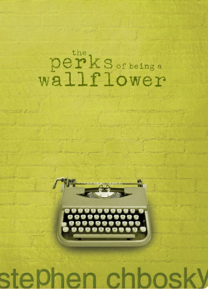 Alt text: Cover of "The Perks of Being a Wallflower" by Stephen Chbosky, featuring a typewriter and text on a textured background