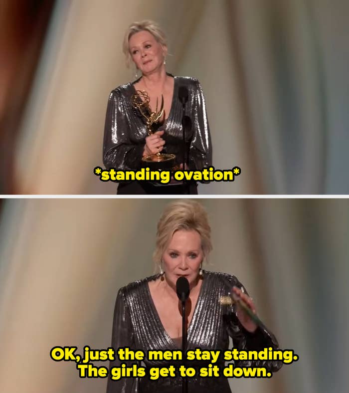 Person holding an Emmy award, wearing a shimmering dress on stage, giving an acceptance speech