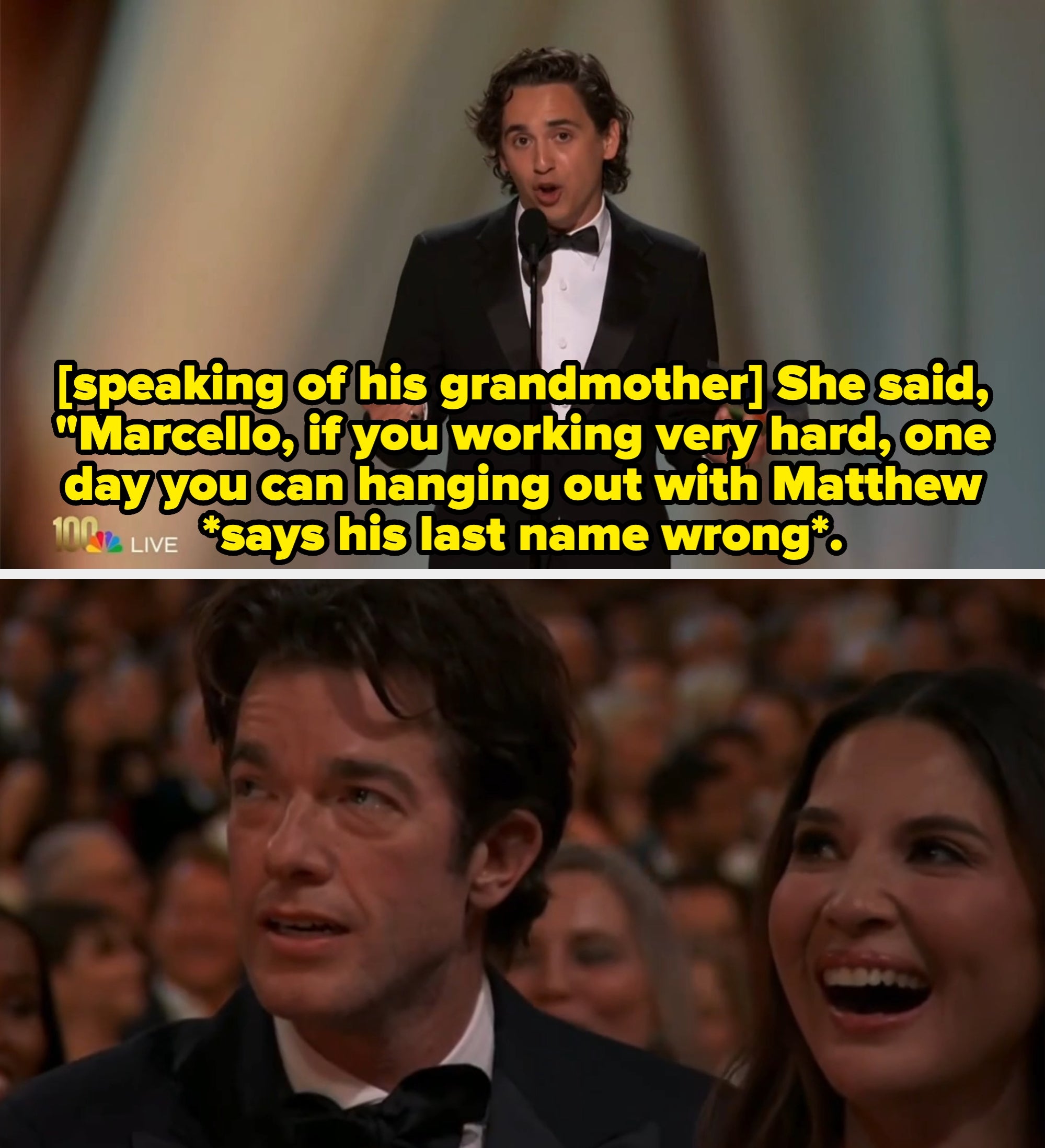 Person speaking into a microphone on stage, wearing a tuxedo, holding an envelope, likely at an awards event