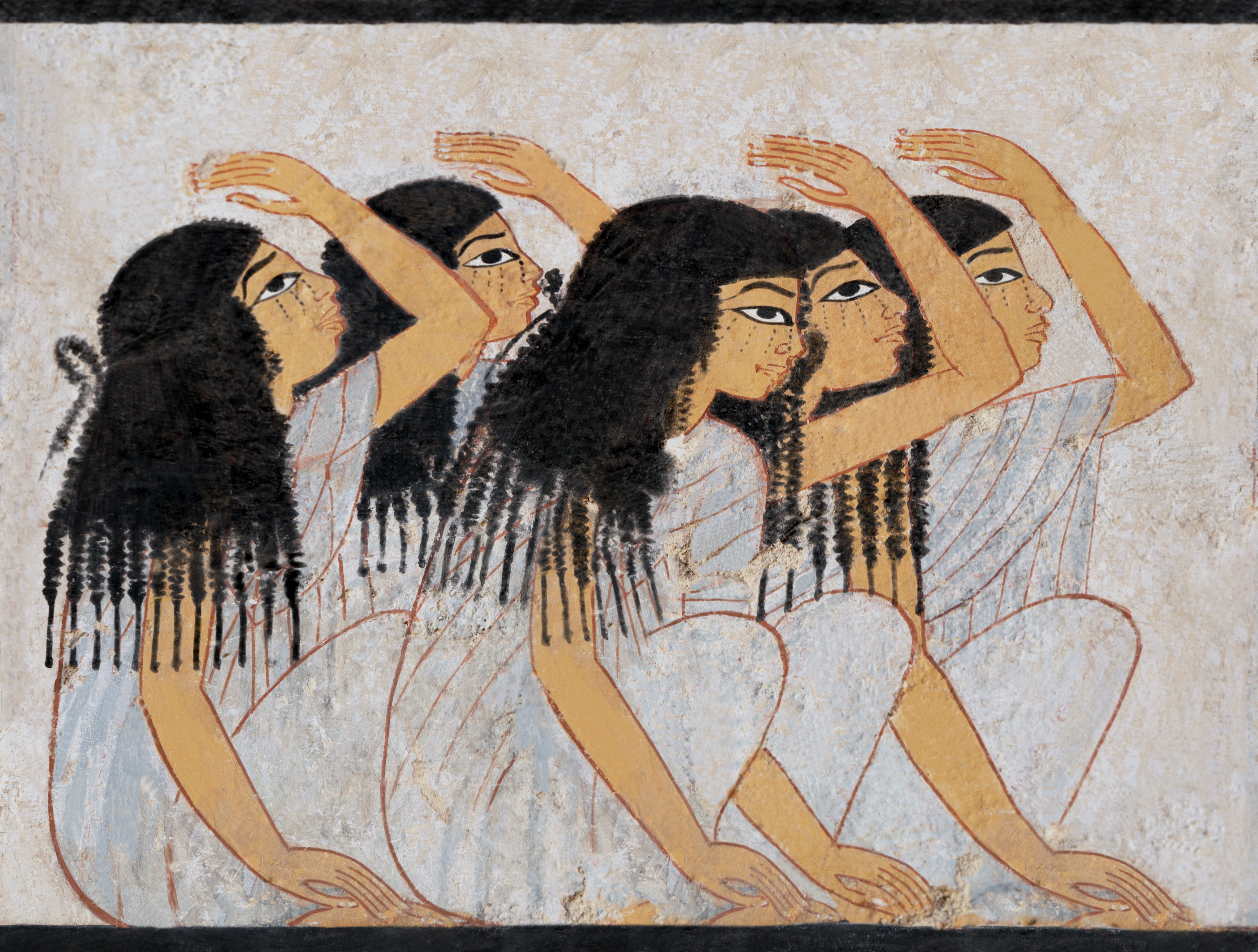 Ancient Egyptian mural depicting four women with stylized hair and profiles, engaging in a ceremonial or ritual gesture