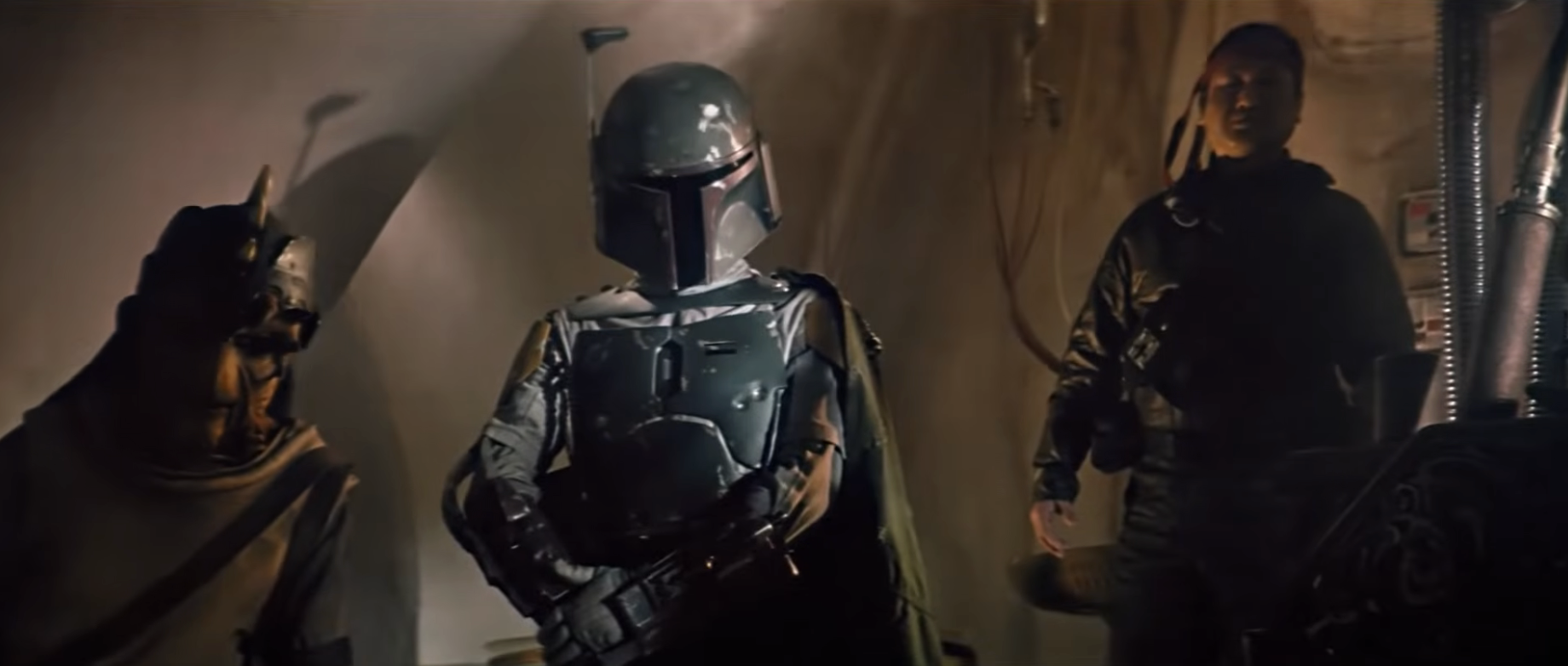 Characters in sci-fi armor and robes stand in a dimly lit room, evoking a classic space adventure scene