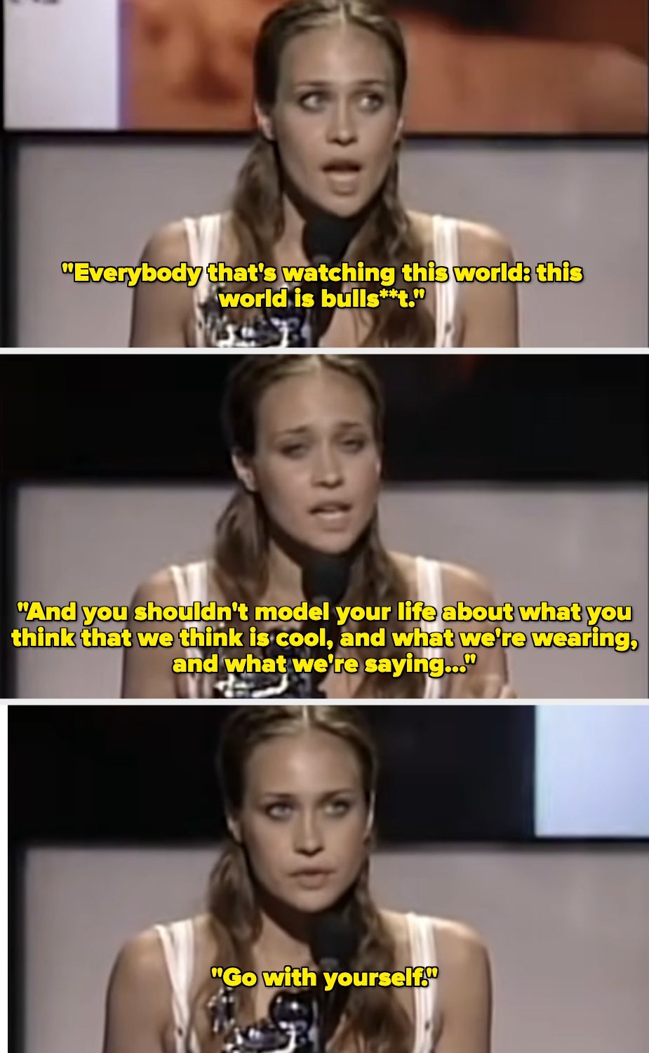 A woman speaks at an award ceremony, expressing that the world is superficial and advising people to be true to themselves