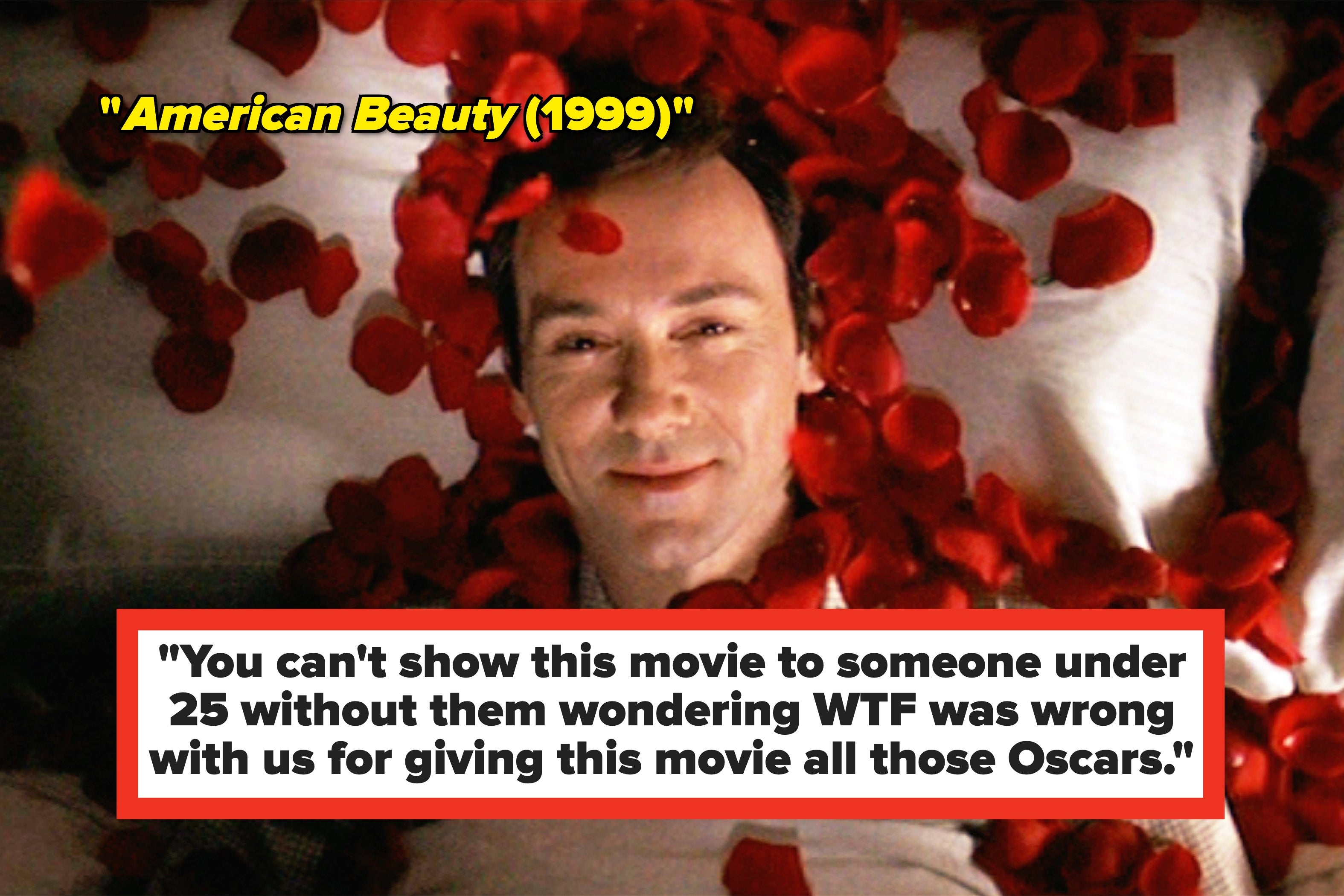 Lester Burnham lies on a bed, surrounded by red rose petals, looking up with a serene expression in the film 'American Beauty'