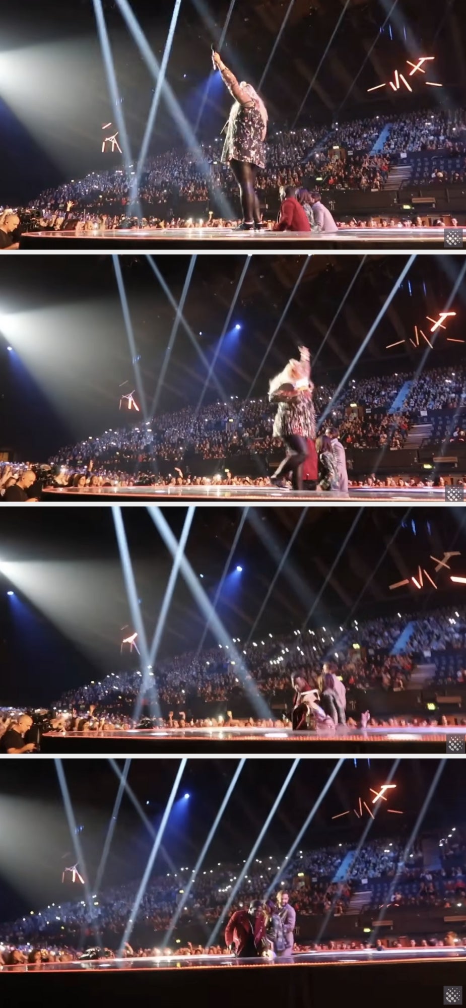 Gemma waves to the crowd then turns around and falls into a trap door onstage