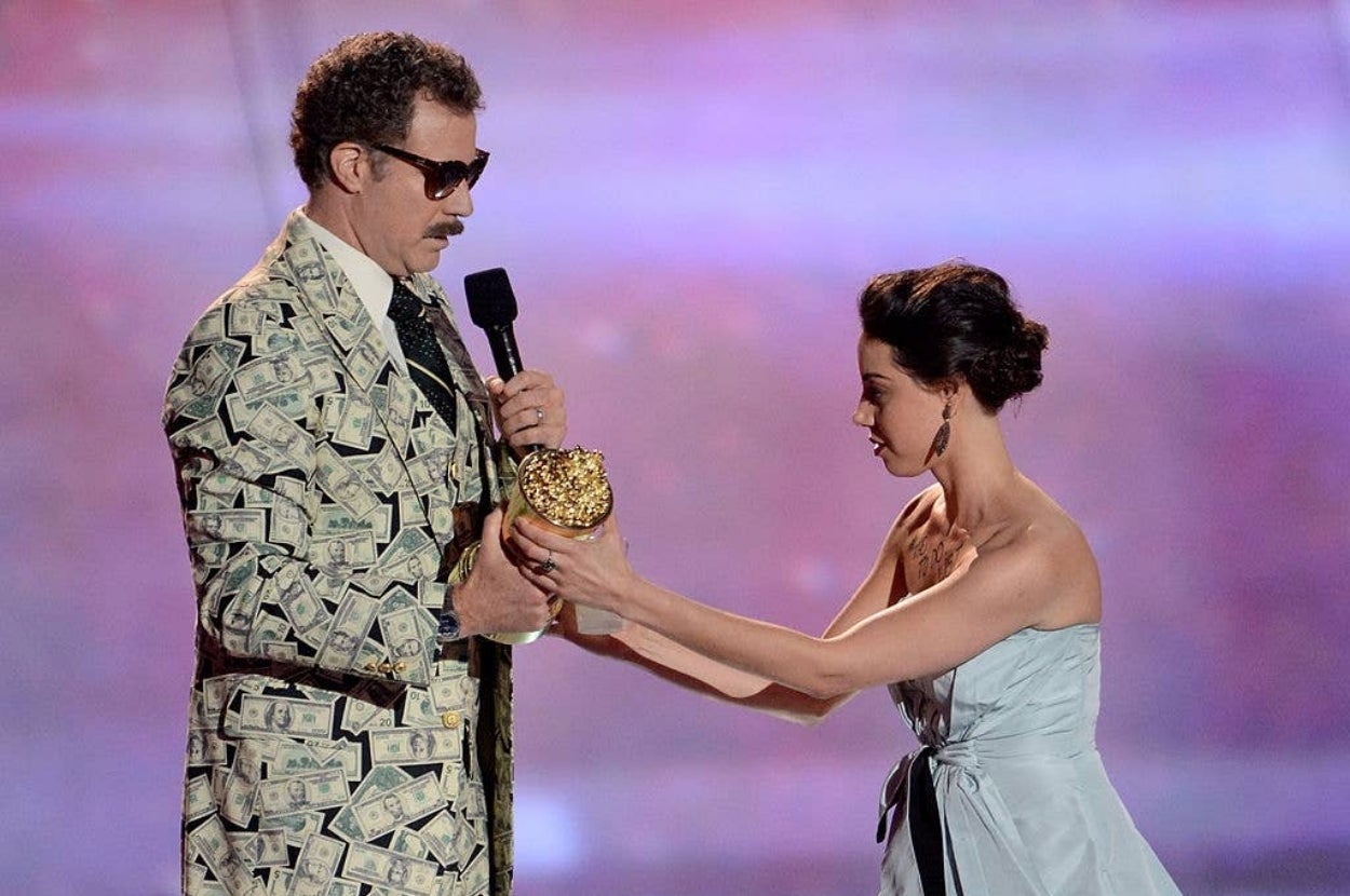 Aubrey Plaza onstage trying to take Will Ferrell's award