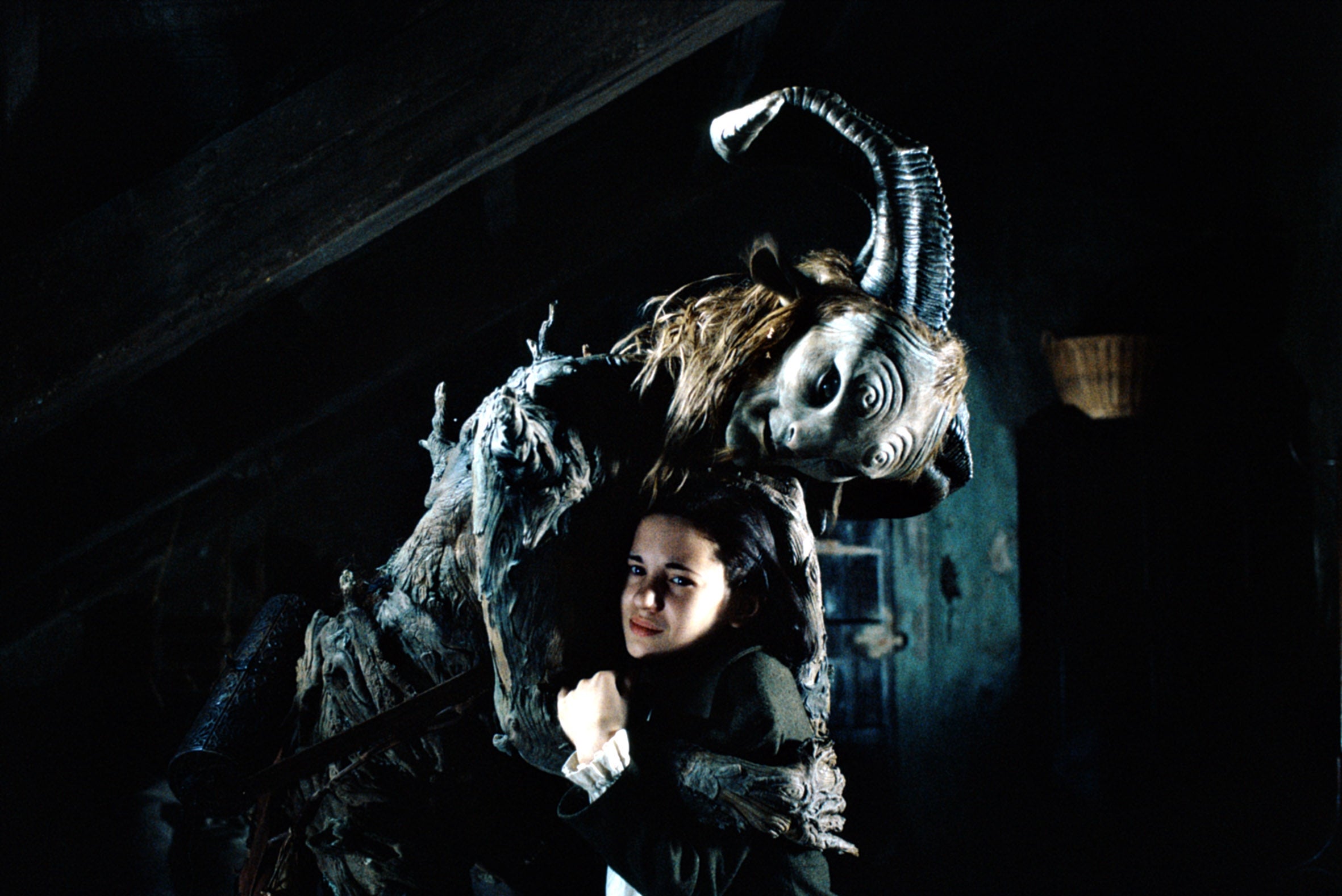 A mysterious carnal   with ornate horns stands down  a girl, conveying a fantastical and eerie atmosphere