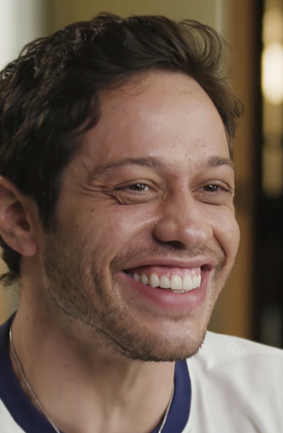 Person smiling brightly, wearing a casual shirt, featured in an article about internet discoveries