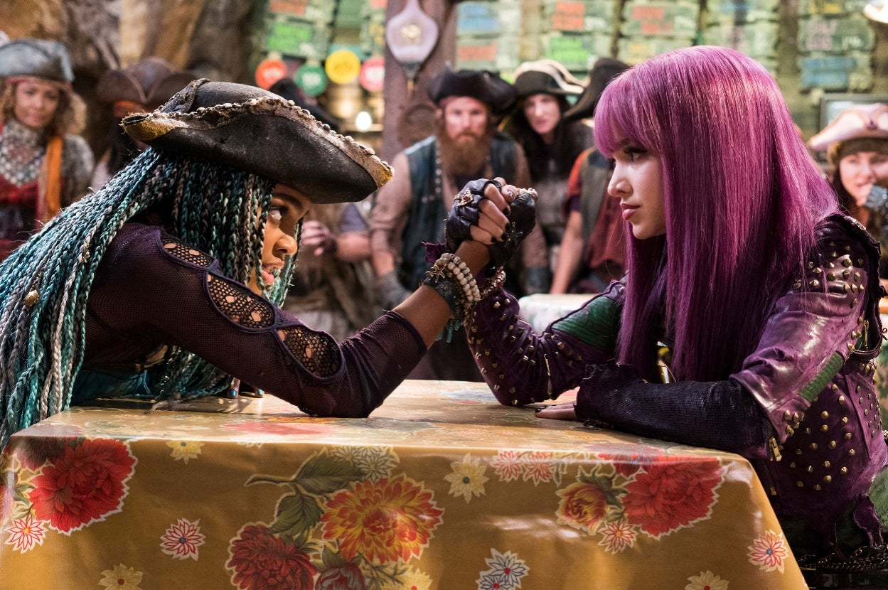 Two characters with distinct hairstyles and pirate-inspired outfits engaged in an arm-wrestling match, surrounded by onlookers