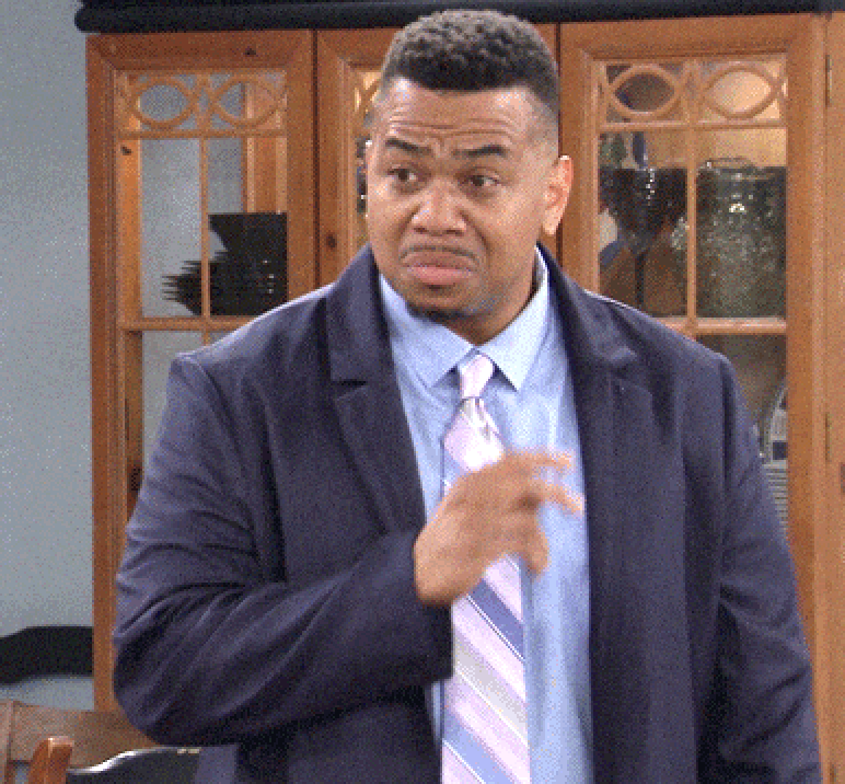 Person successful a suit and necktie appears confused successful a country setting, gesturing with 1 hand