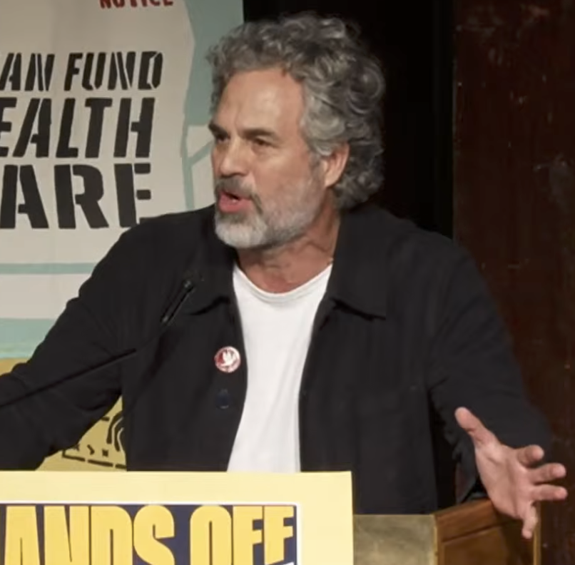 Mark Ruffalo speaking passionately at a podium