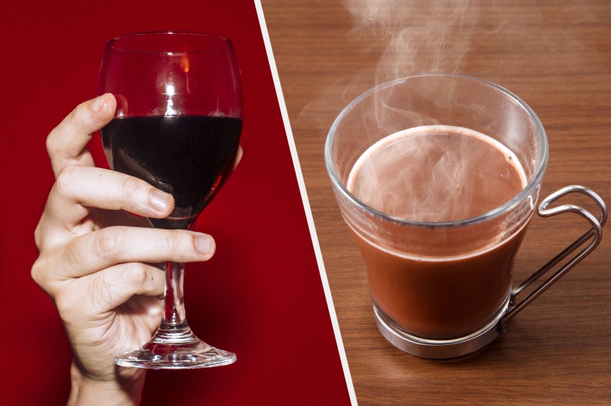 A hand holds a glass of wine. Next to it, a steaming cup of coffee rests on a table