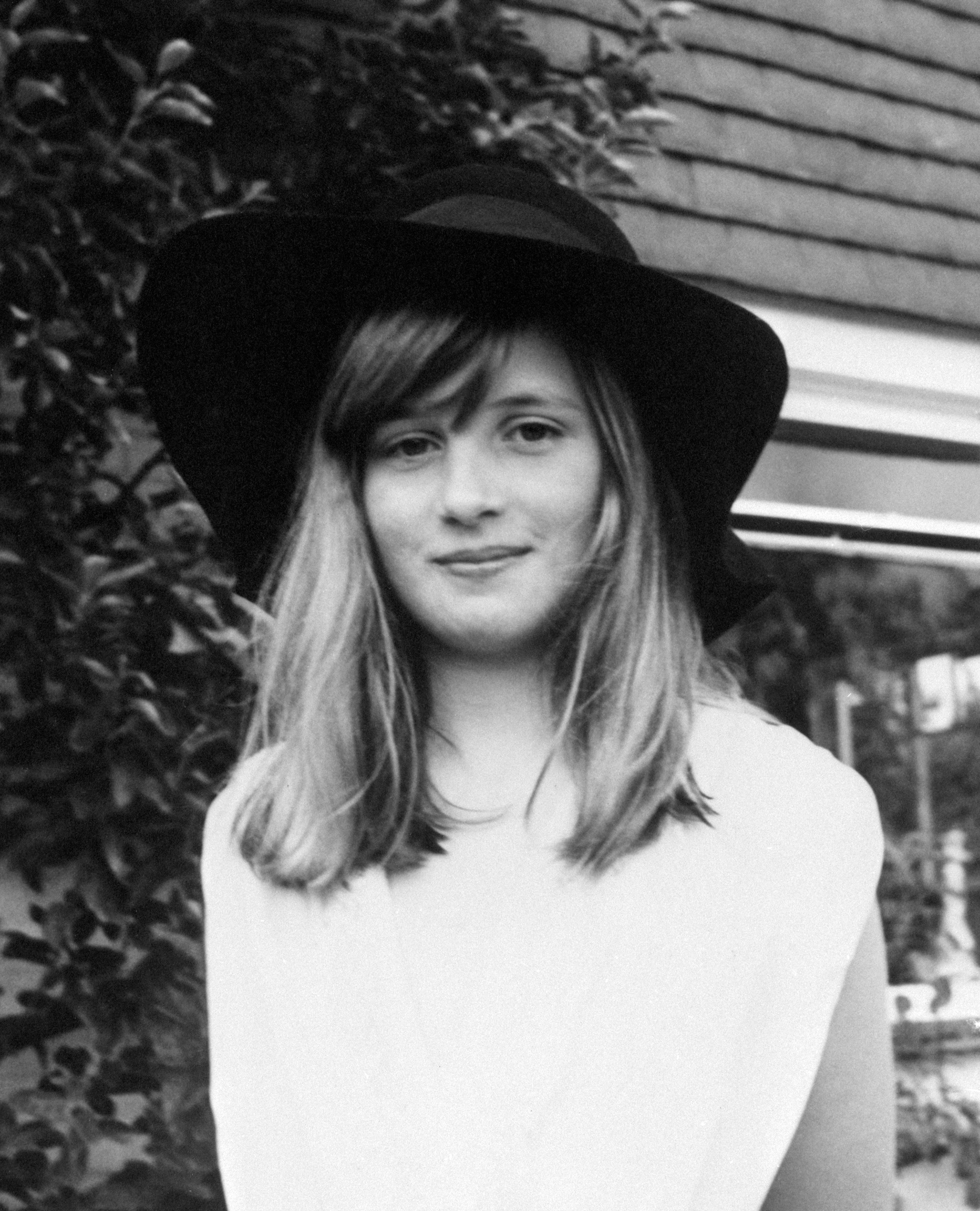 Lady Diana Spencer wearing a hat and white top