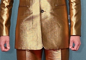 Person in a shiny, metallic suit on a red carpet at the BFI London Film Festival