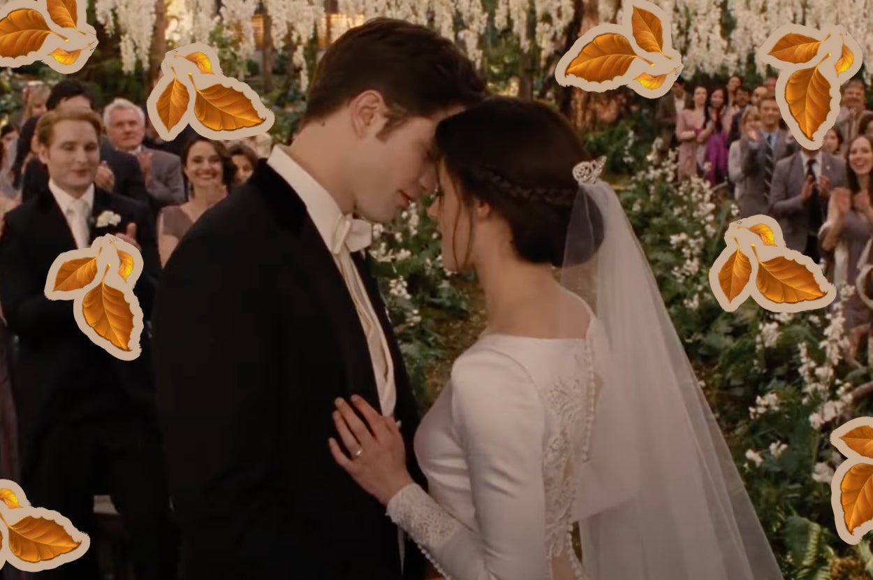 Edward and Bella in "Twilight" in wedding attire sharing an intimate moment at an outdoor ceremony. Guests applaud in the background