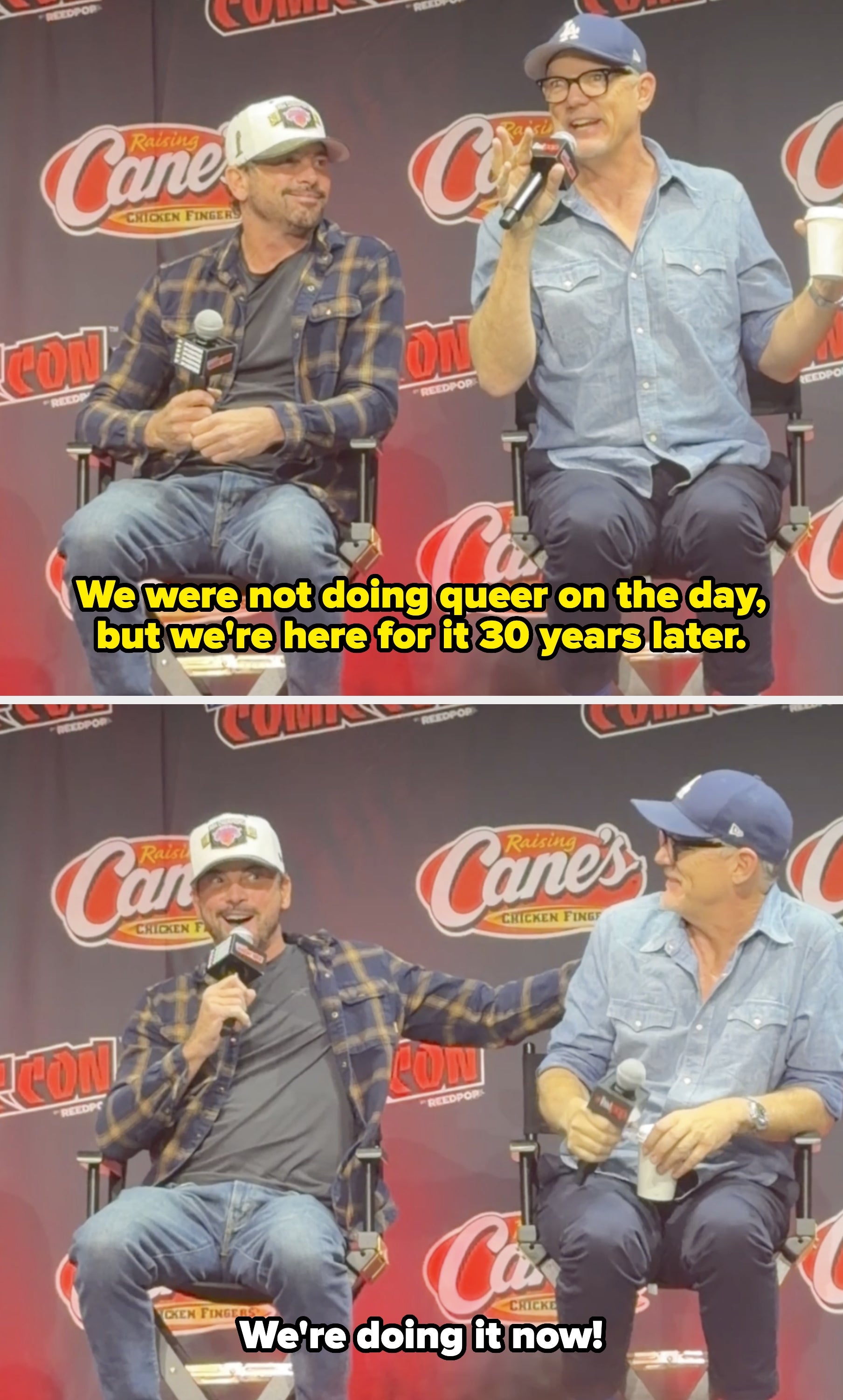 Two men on stage at a convention, wearing casual shirts and caps, holding microphones, sitting in front of a Raising Cane's backdrop
