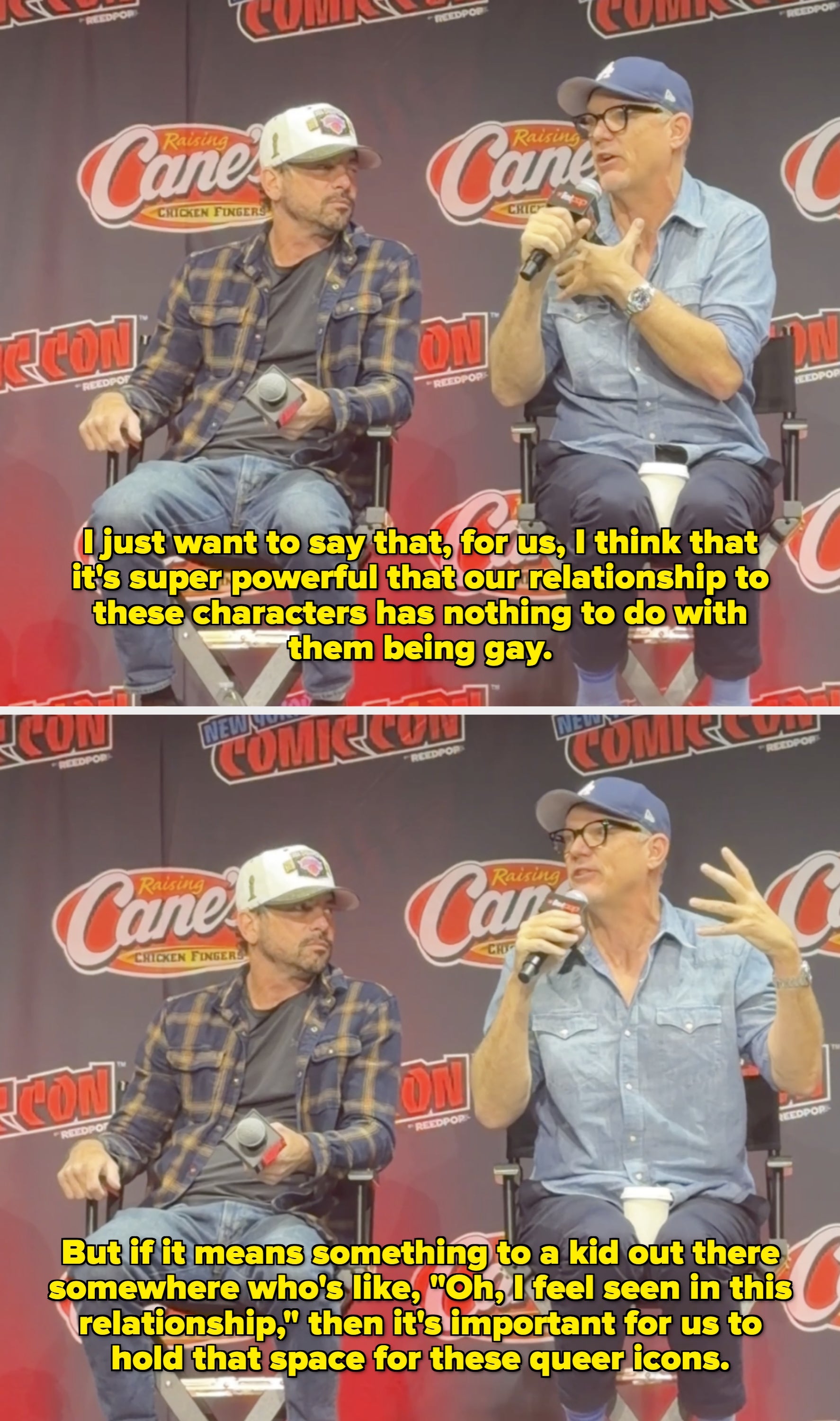 Two people seated at a panel event discussing, one in a plaid shirt and cap, the other in a button-up shirt and cap, both holding microphones
