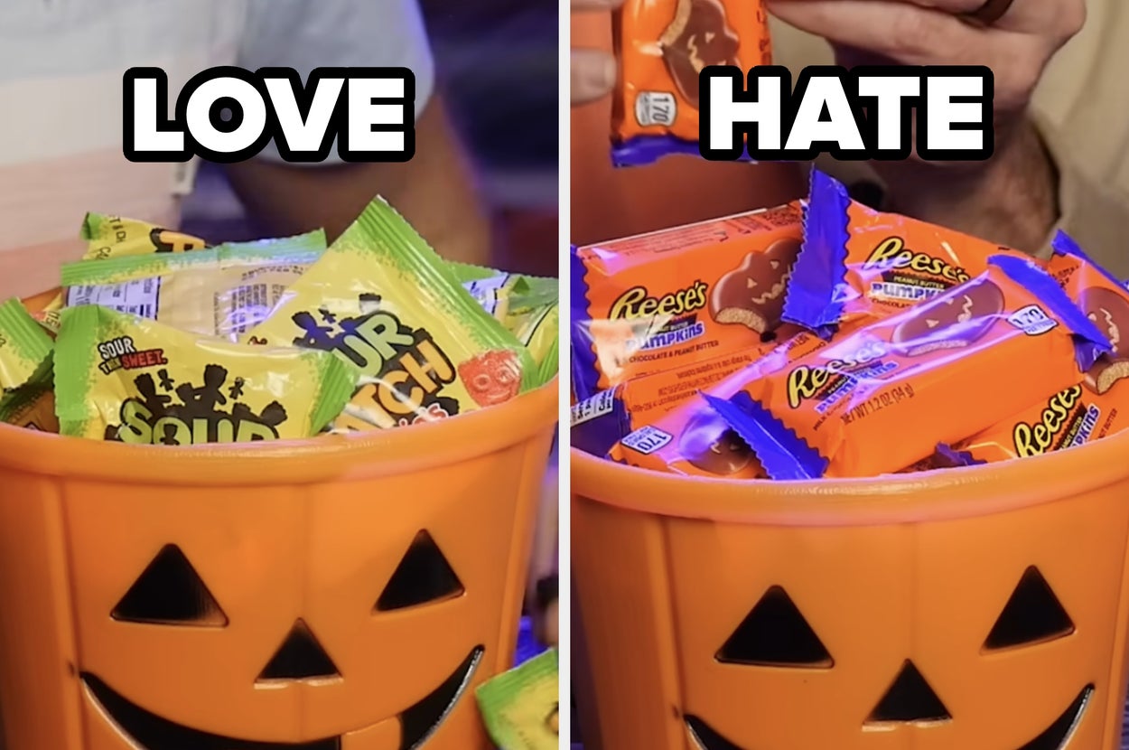 Two jack-o'-lantern buckets filled with candy, including Sour Patch Kids and Reese's, ready for Halloween festivities