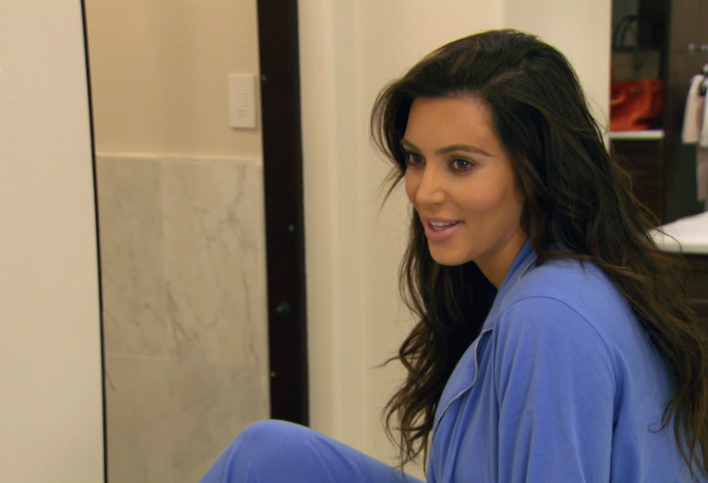 Kim smiling in a TV clip