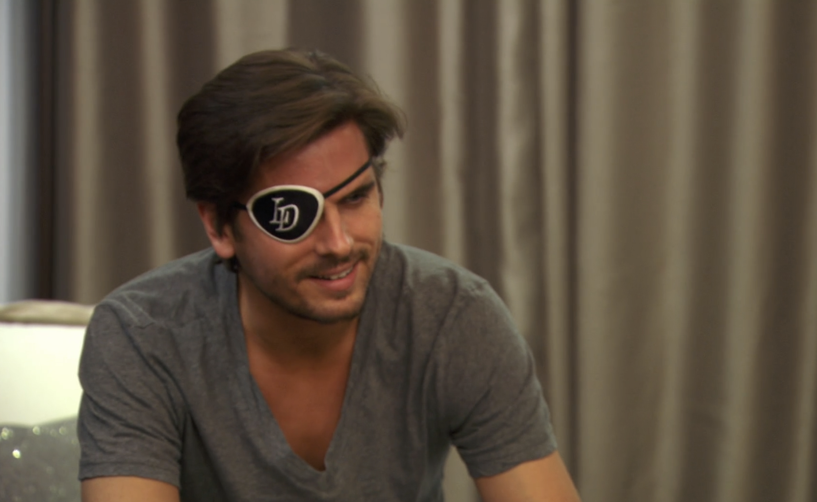 Scott smiling in a TV clip