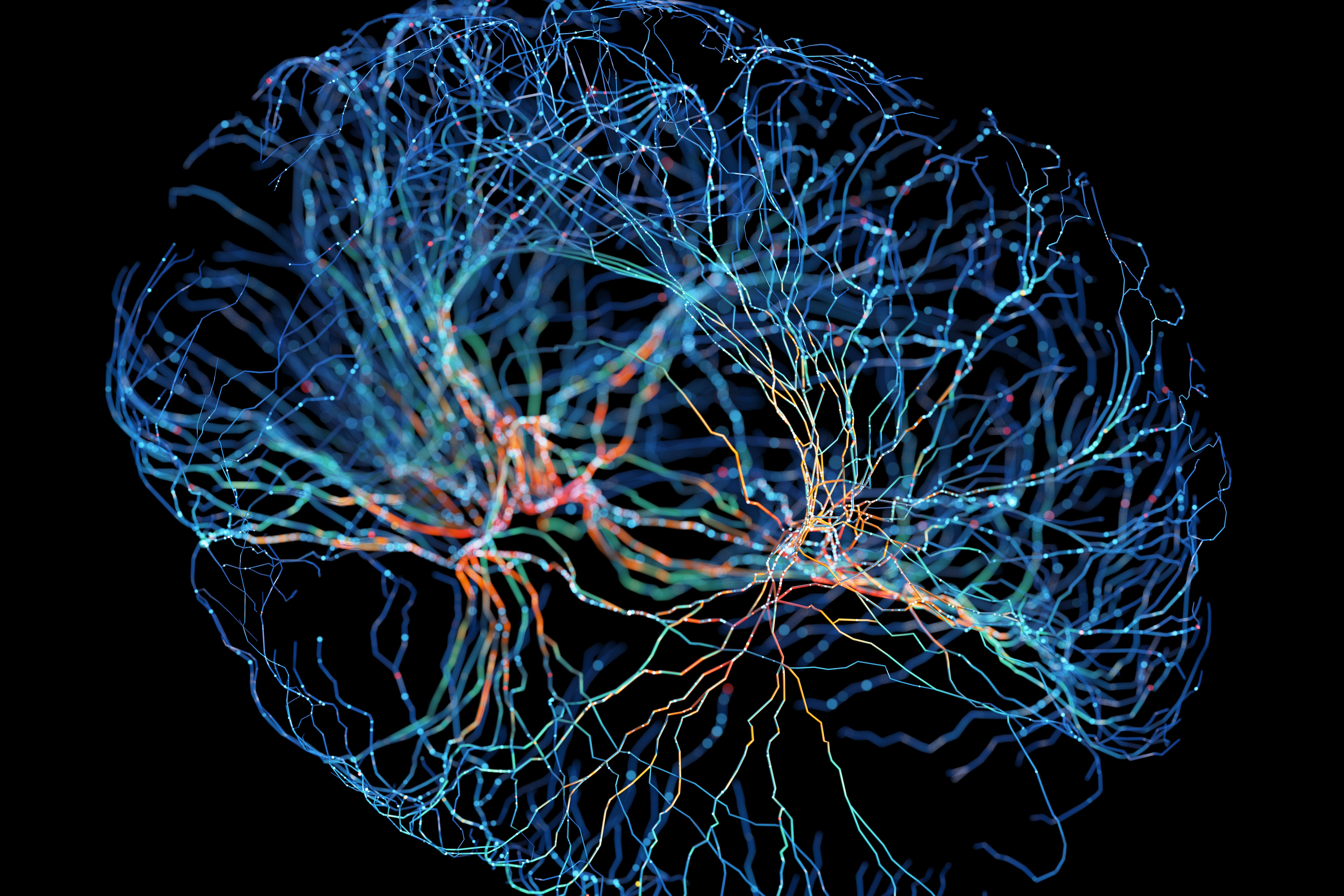 Abstract depiction of a human brain with glowing, interconnected neural networks against a dark background