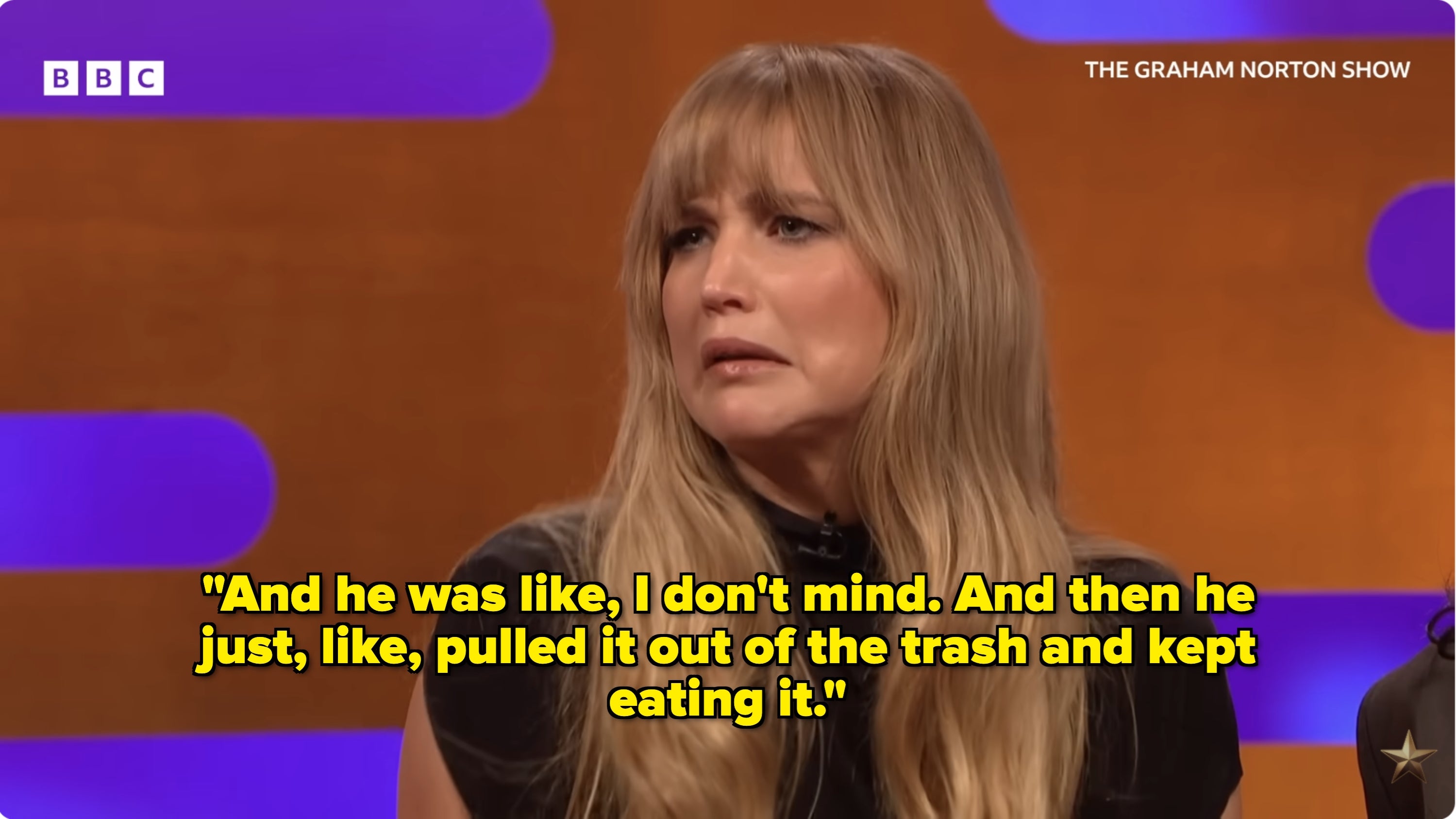 A person with long hair looks surprised while on "The Graham Norton Show" set