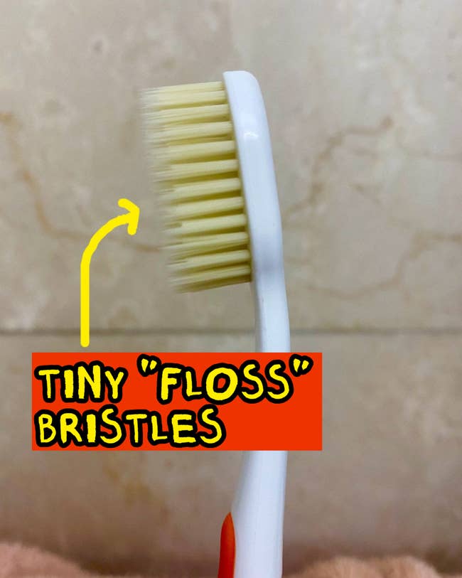 A toothbrush with 2  layers of bristles, 1  agelong  and bladed  and 1  shorter and thicker 