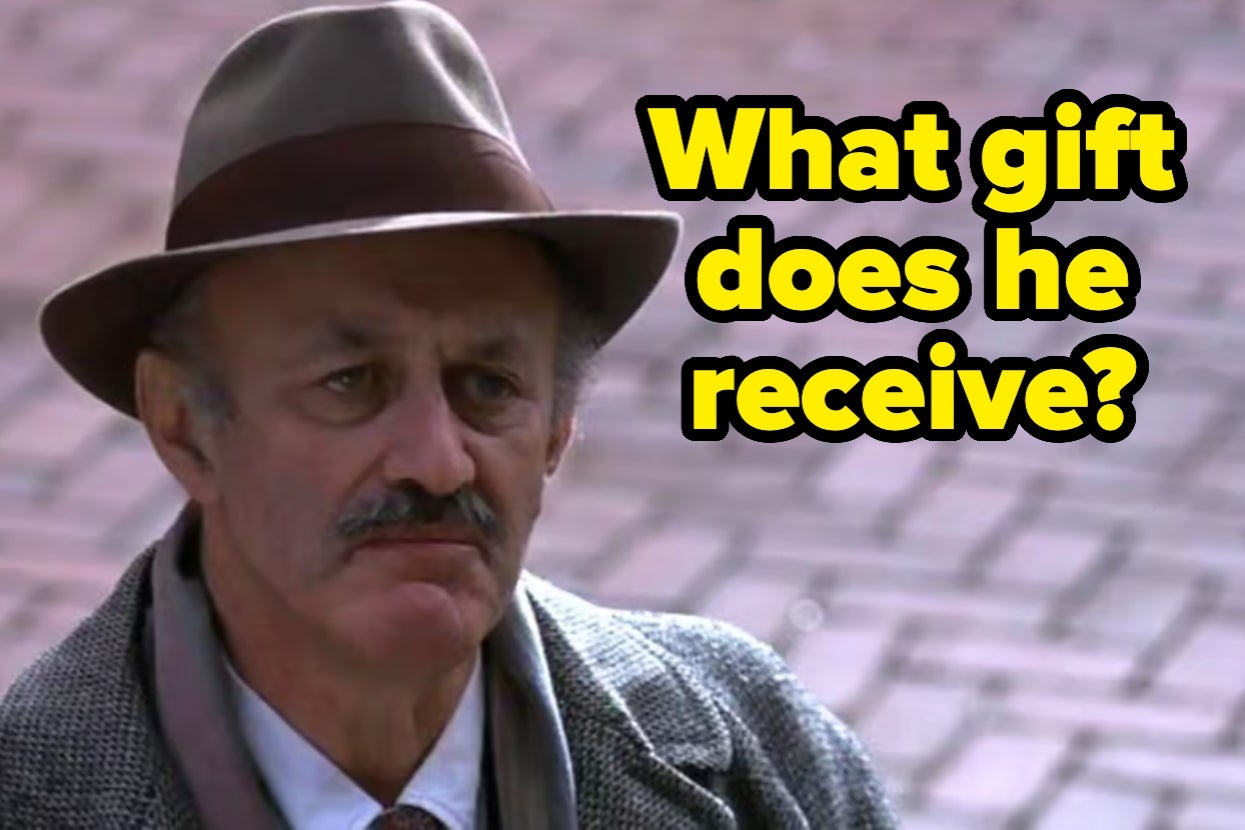 Man in suit and hat looks pensive; text asks, "What gift does he receive?"