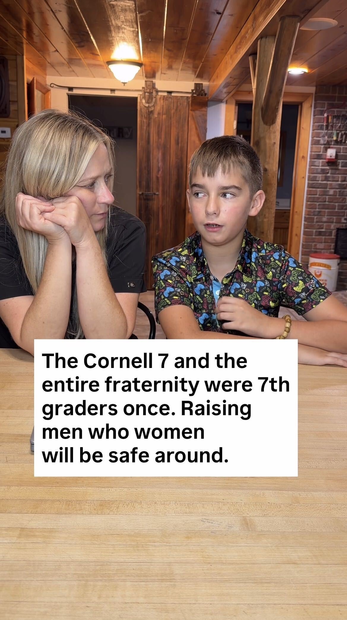 A woman and a young boy sit at a table looking at each other. The overlaid text discusses raising respectful men