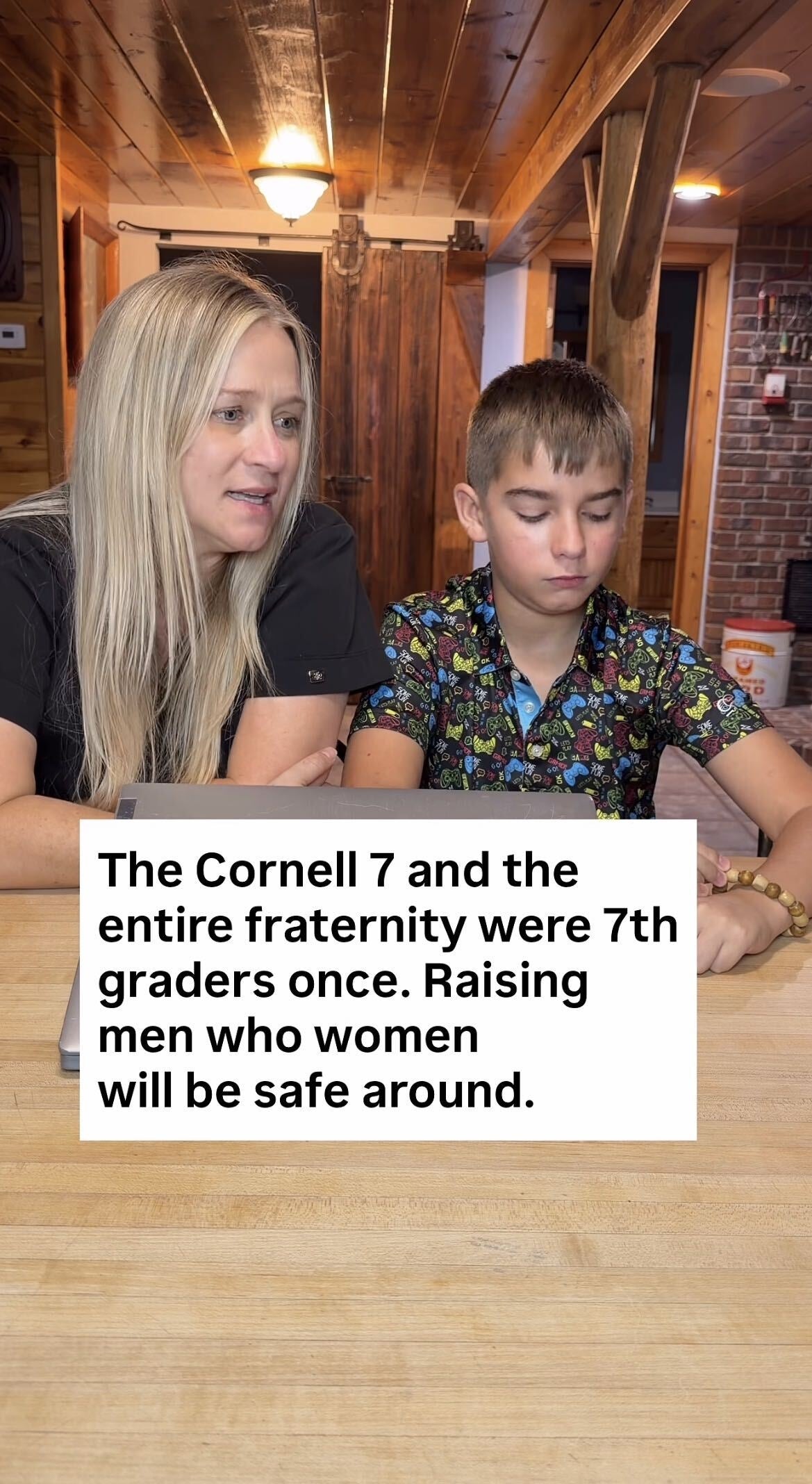 A woman and a young boy sit at a table, looking thoughtful. Text reads: "The Cornell 7... Raising men who women will be safe around."