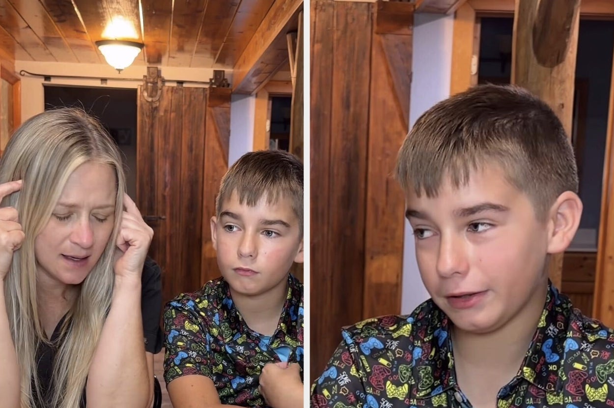 Woman and boy sitting at a table with thoughtful expressions inside a cozy, wooden room