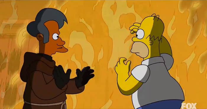 Animated characters Homer Simpson and Apu successful  a fiery setting. Apu wears a brownish  monk robe, portion    Homer appears startled.