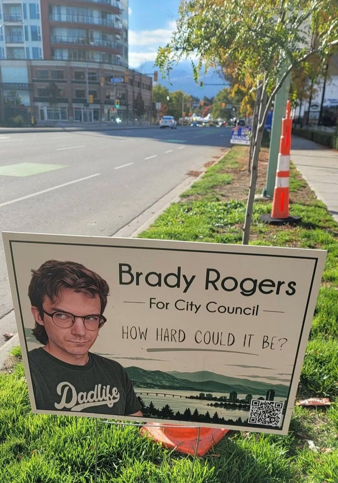 Yard motion for Brady Rogers' metropolis assembly run with the slogan "How hard could it be?" and a QR code