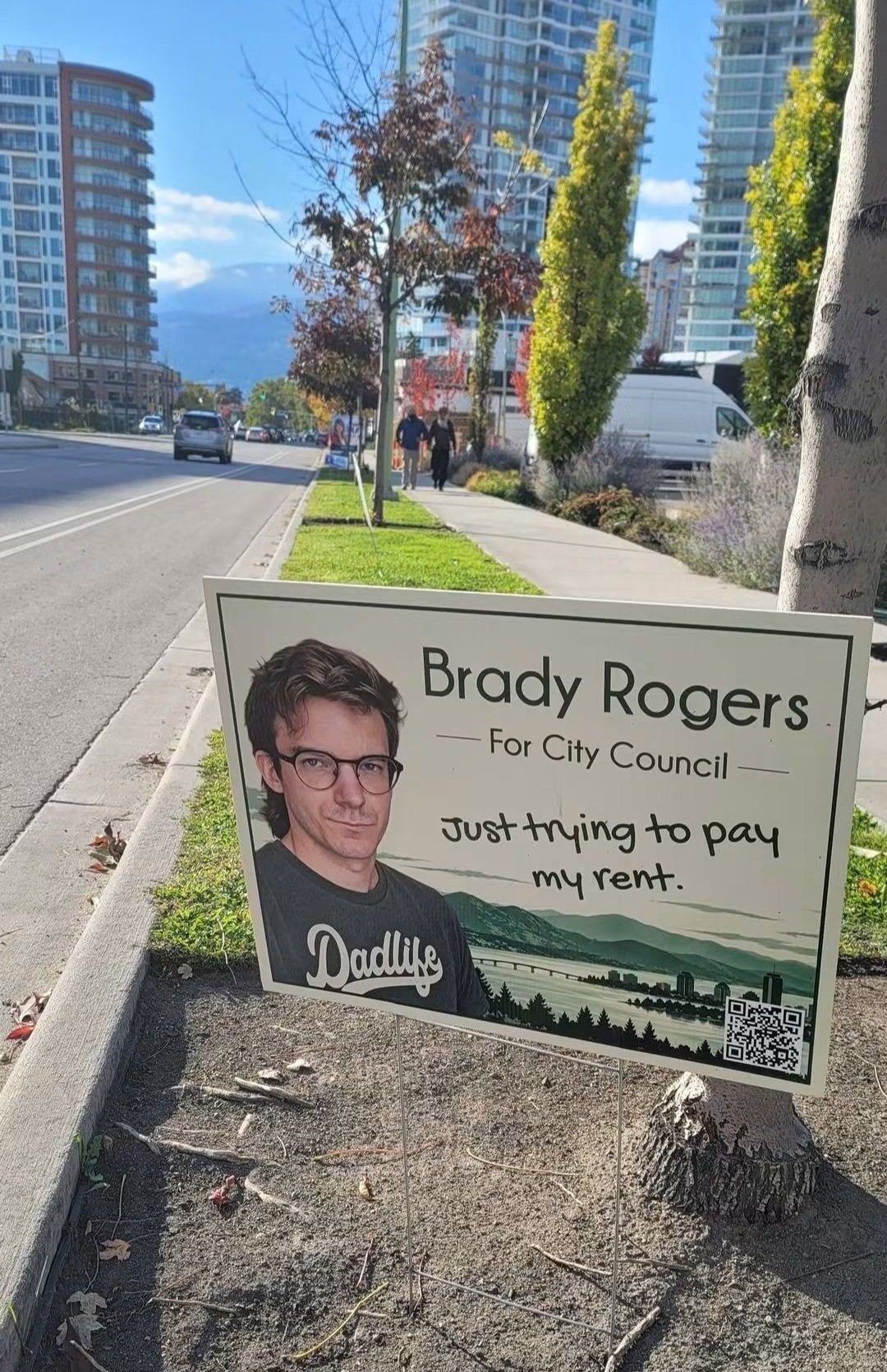 Campaign motion for Brady Rogers moving for metropolis council, with slogan "Just trying to wage my rent" and a QR code