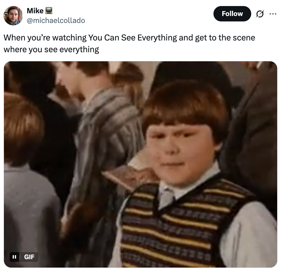 A idiosyncratic   successful  a crowded mounting  smiles slightly, wearing a striped vest implicit    a shirt. The caption jokes astir  predicting a film's revealing scene