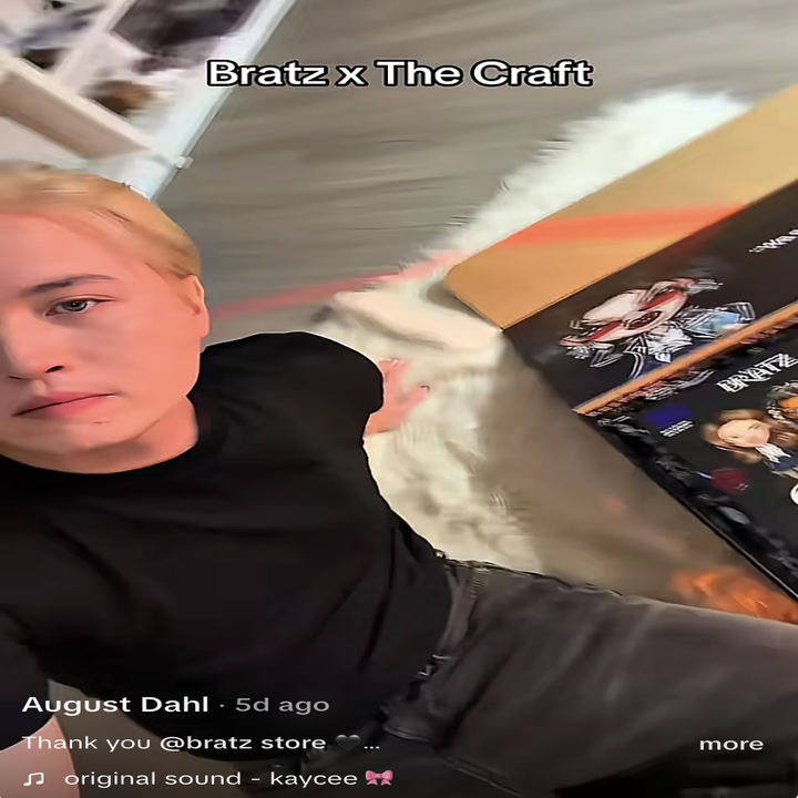 Person taking a selfie seated next to Bratz x The Craft dolls set