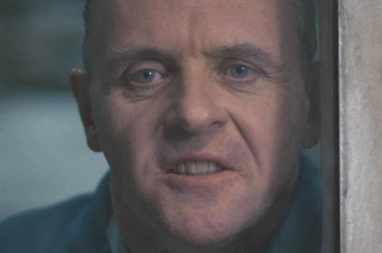 Person looking intently at the camera through glass, character known for intense gaze in TV and movies