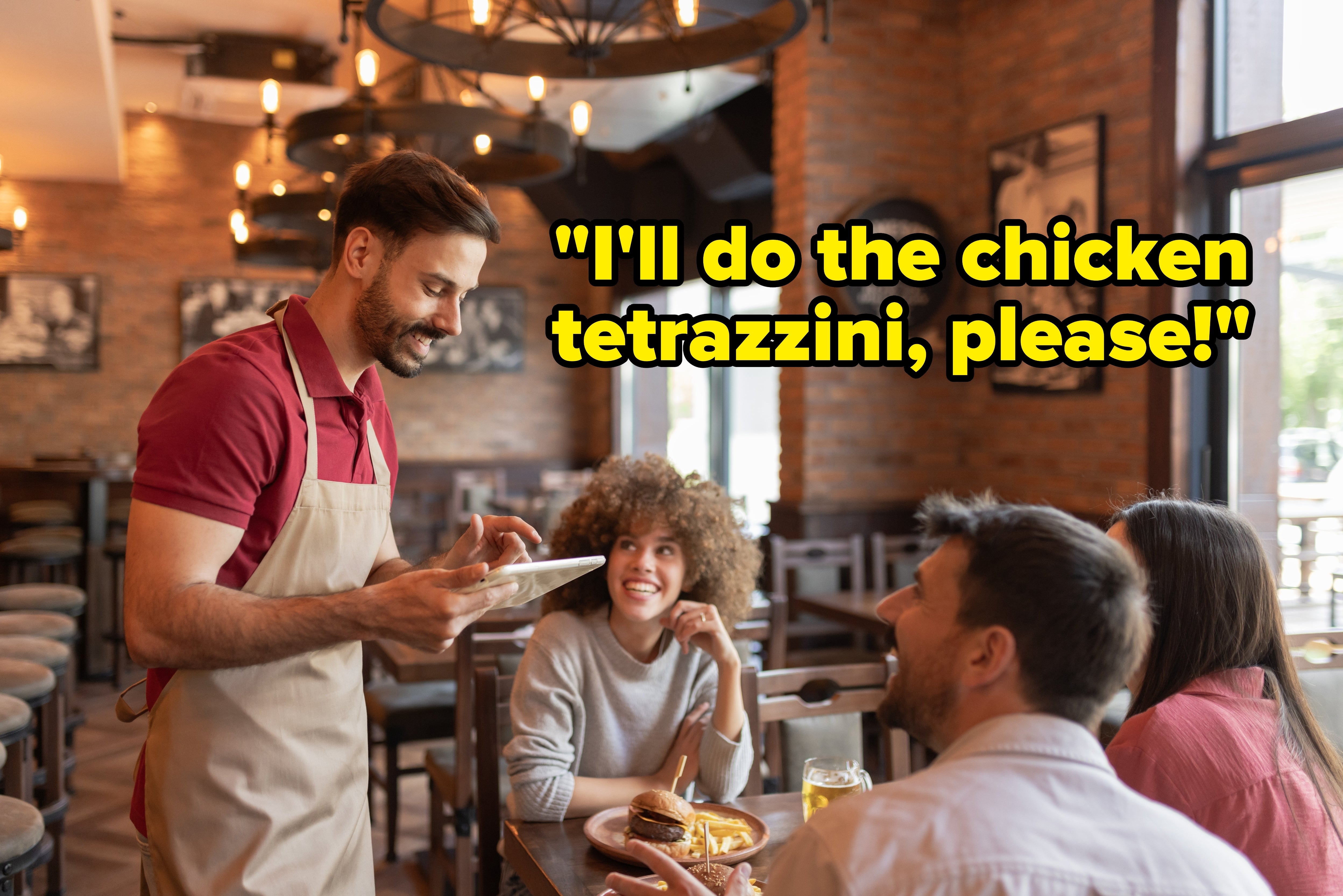 Waiter taking an bid from 3 seated customers successful a casual restaurant. They are smiling and engaged successful conversation