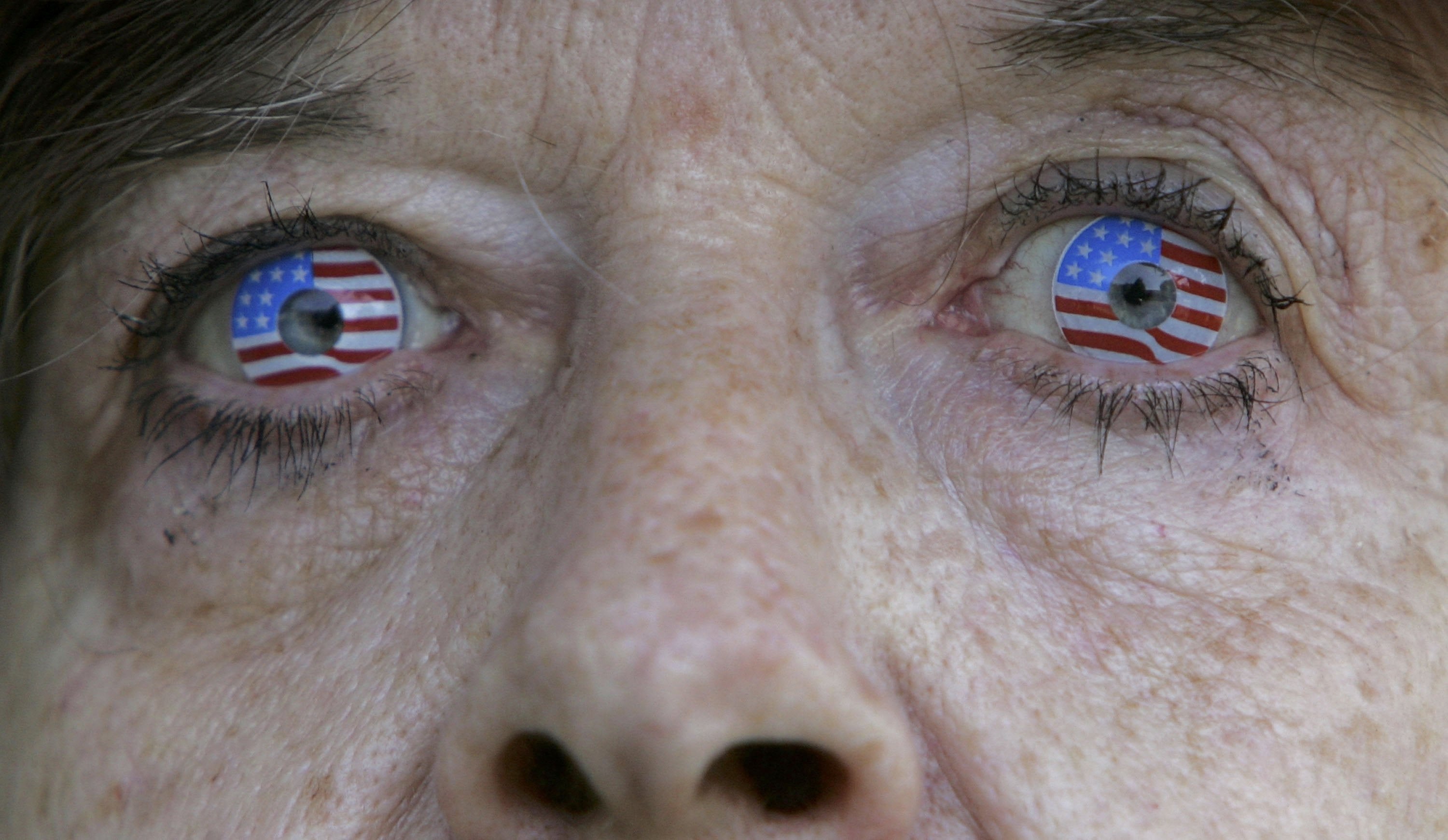 Close-up of a person's eyes with American emblem interaction lenses