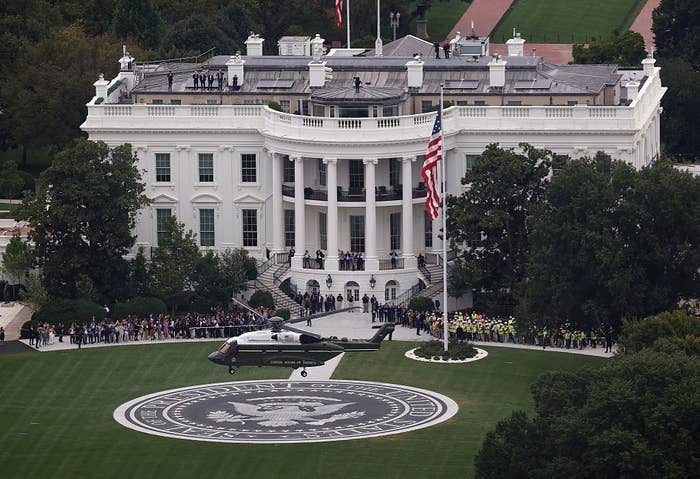 A chopper  hovers implicit    the South Lawn of the White House, with radical   gathered extracurricular  and an American emblem  prominently displayed