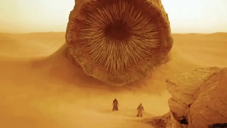 Two radical   basal   successful  a godforsaken  facing a monolithic  sandworm emerging from the dunes