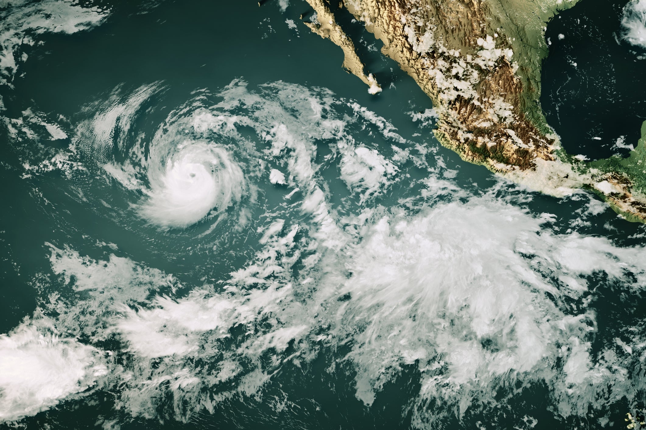Satellite representation  of a swirling hurricane adjacent   the seashore  of Mexico, viewed from above