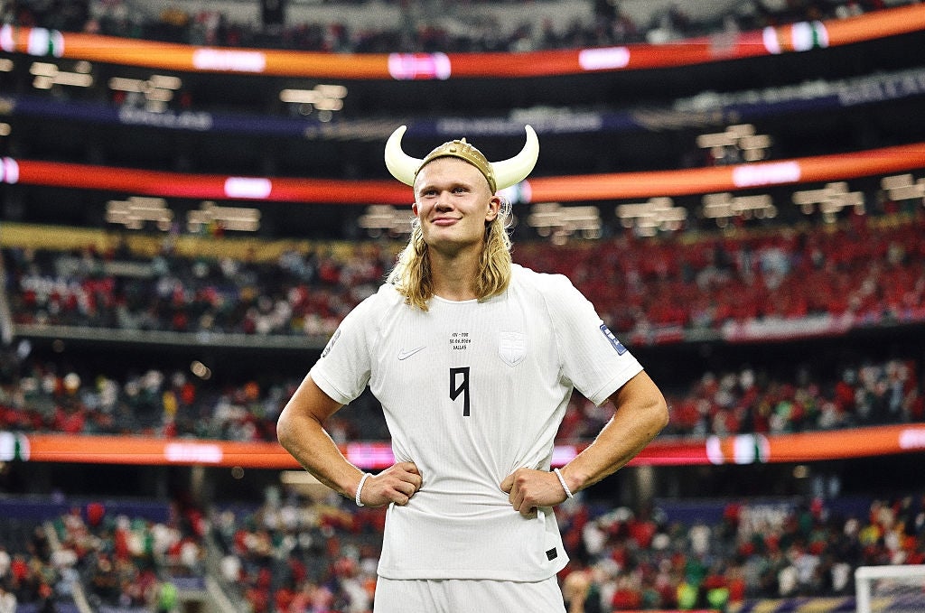 Person successful  a achromatic  sports azygous   and Viking helmet stands confidently successful  a stadium with hands connected  hips