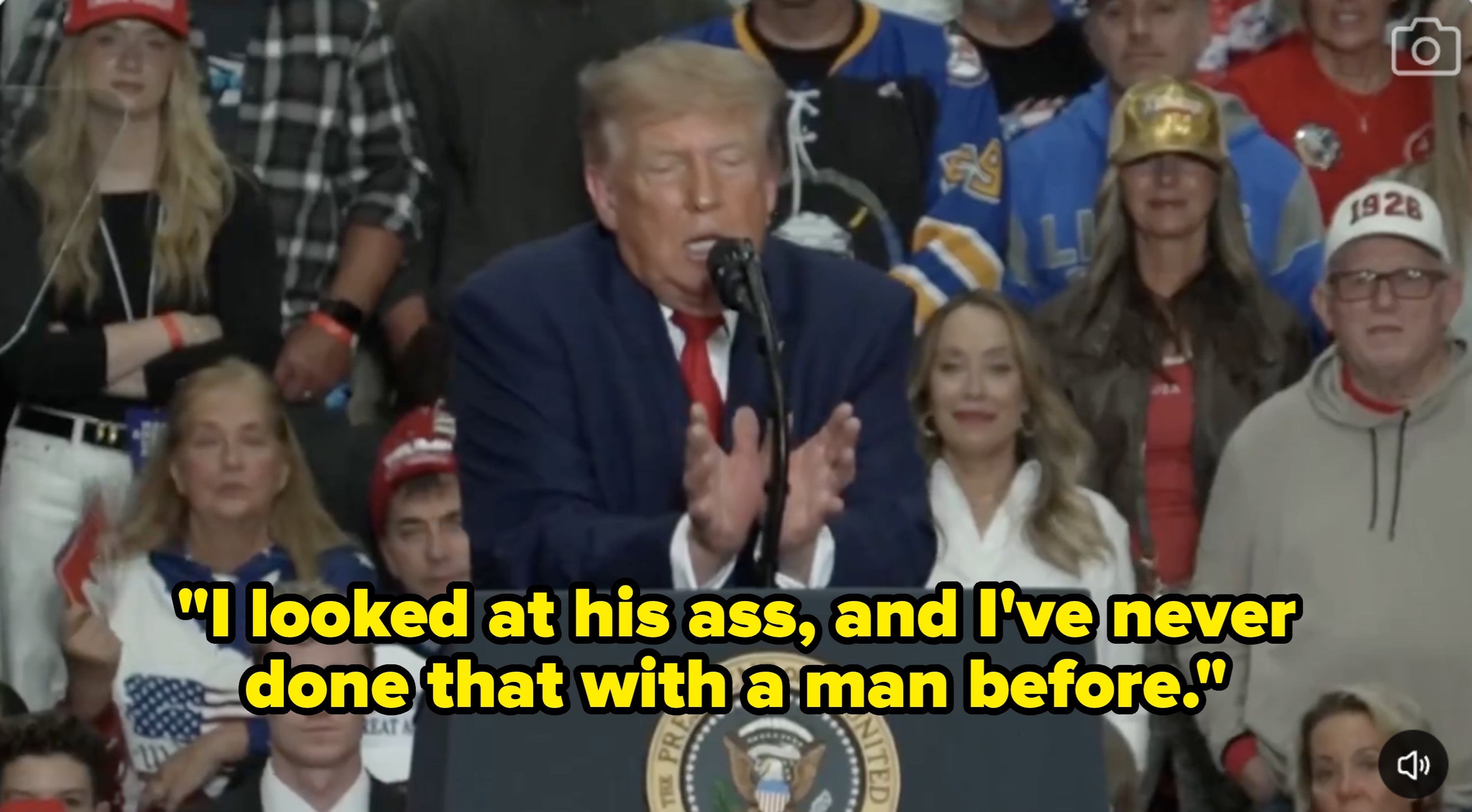 A idiosyncratic   speaks astatine  a podium marked "President of the United States" astatine  a rally, surrounded by attendees successful  casual clothing