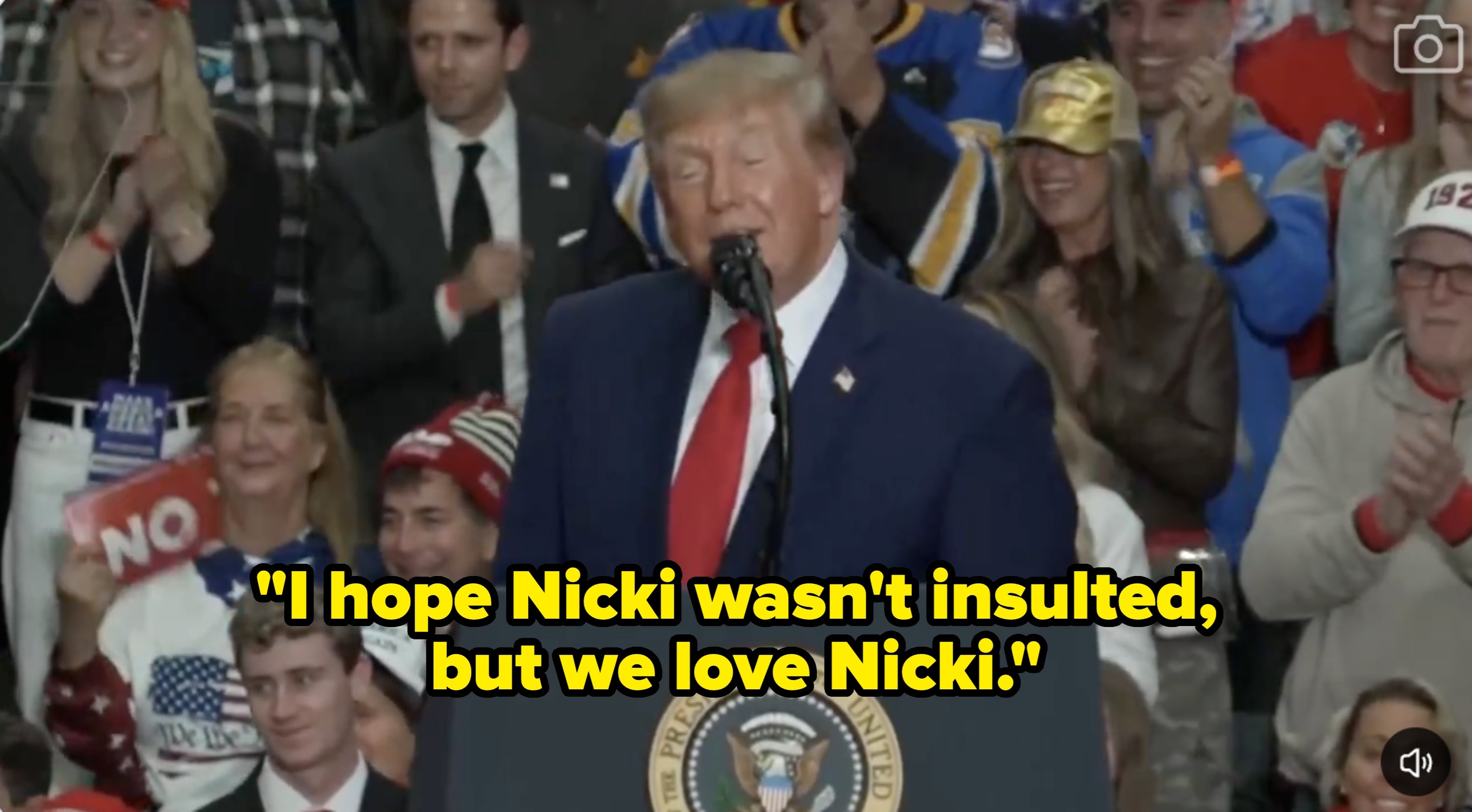 A idiosyncratic   stands astatine  a podium labeled "President of the United States," speaking to a cheering assemblage  astatine  an event